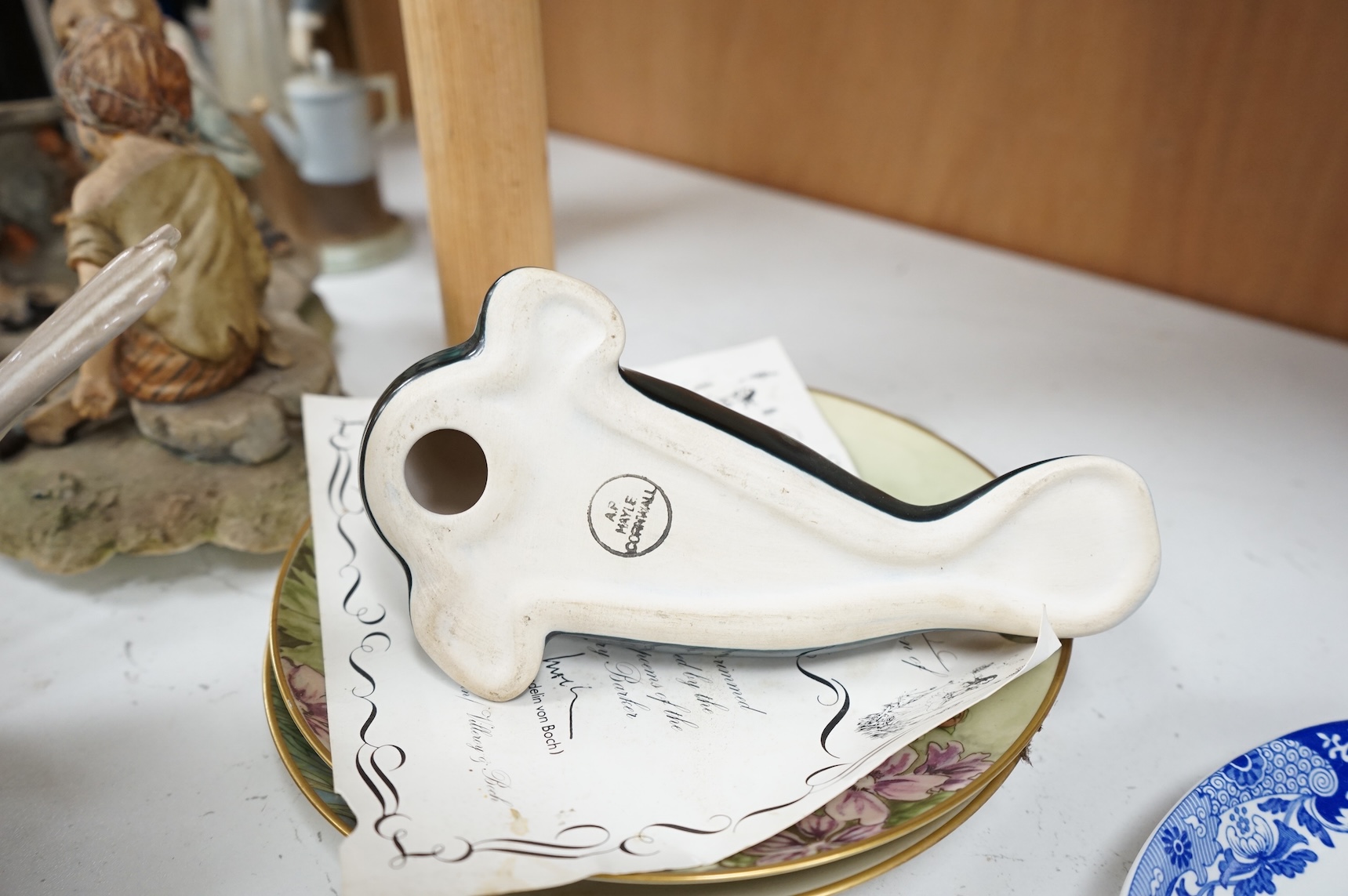 A collection of pottery and porcelain to include a Hayle model of a seal, Lladro figures and a pair of Fairy cabinet plates, largest 27cm wide